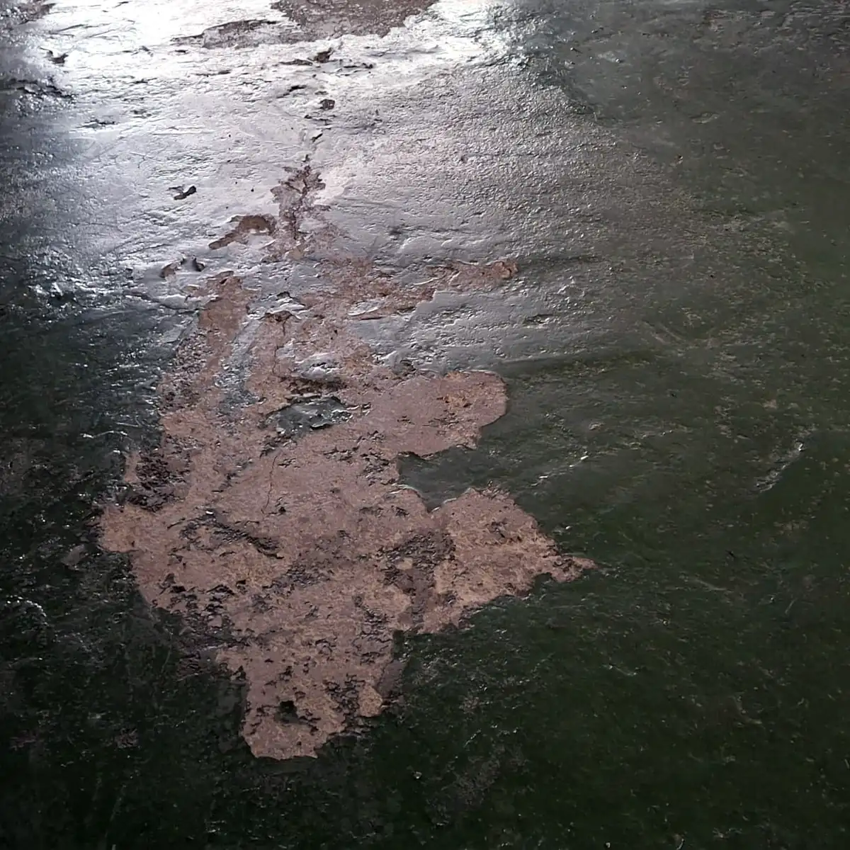 Old acrylic paint peeling off the concrete in large patches, Puigcerdà Old acrylic paint peeling off the concrete in large patches, Puigcerdà