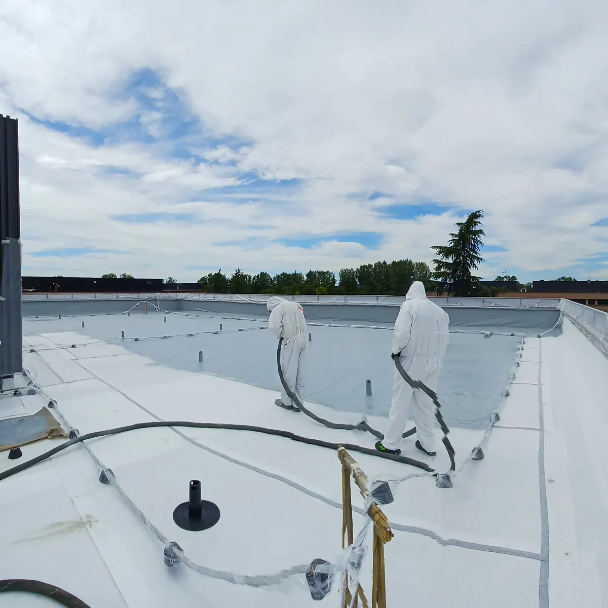 Completed bright white bank roof waterproofing, Milan