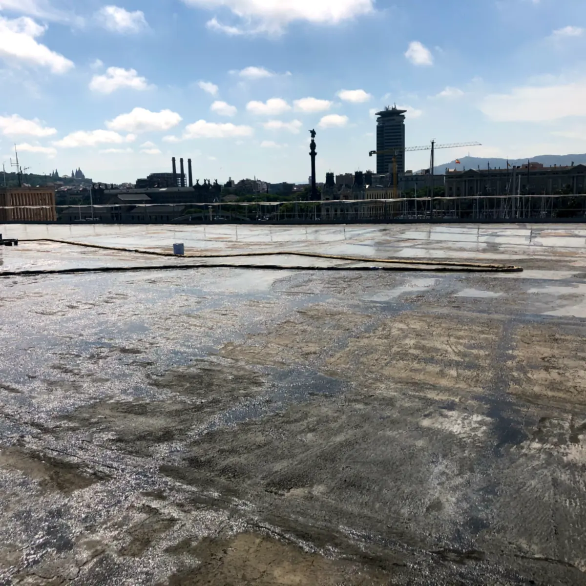 Cleaned slab ready for the epoxy primer Car park roof waterproofing Barcelona: cleaned roof slab before priming at Maremagnum