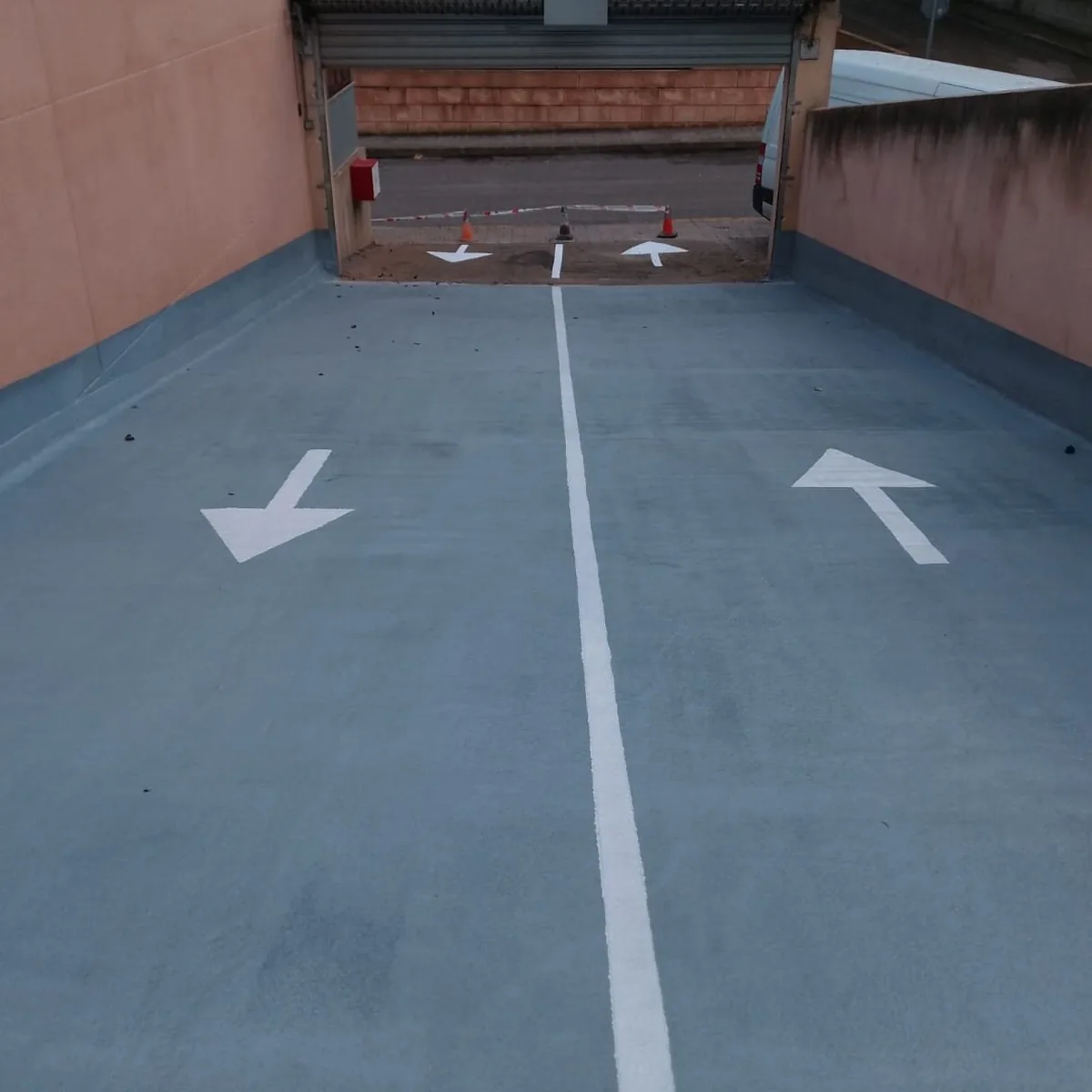 Ramp entrance with white lane lines on the blue finish, Mallorca