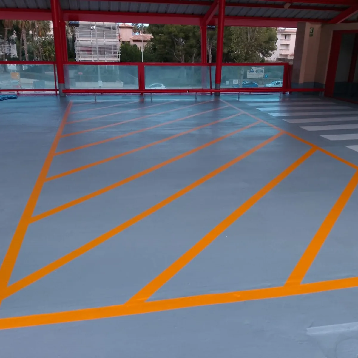 Yellow hatched no-parking zone on the waterproofed car park roof, Mallorca