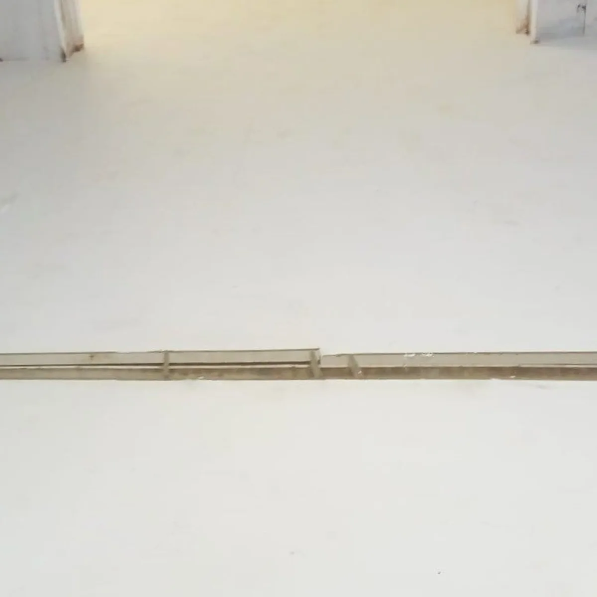 Clean grey floor and wall base in a production room, Menorca