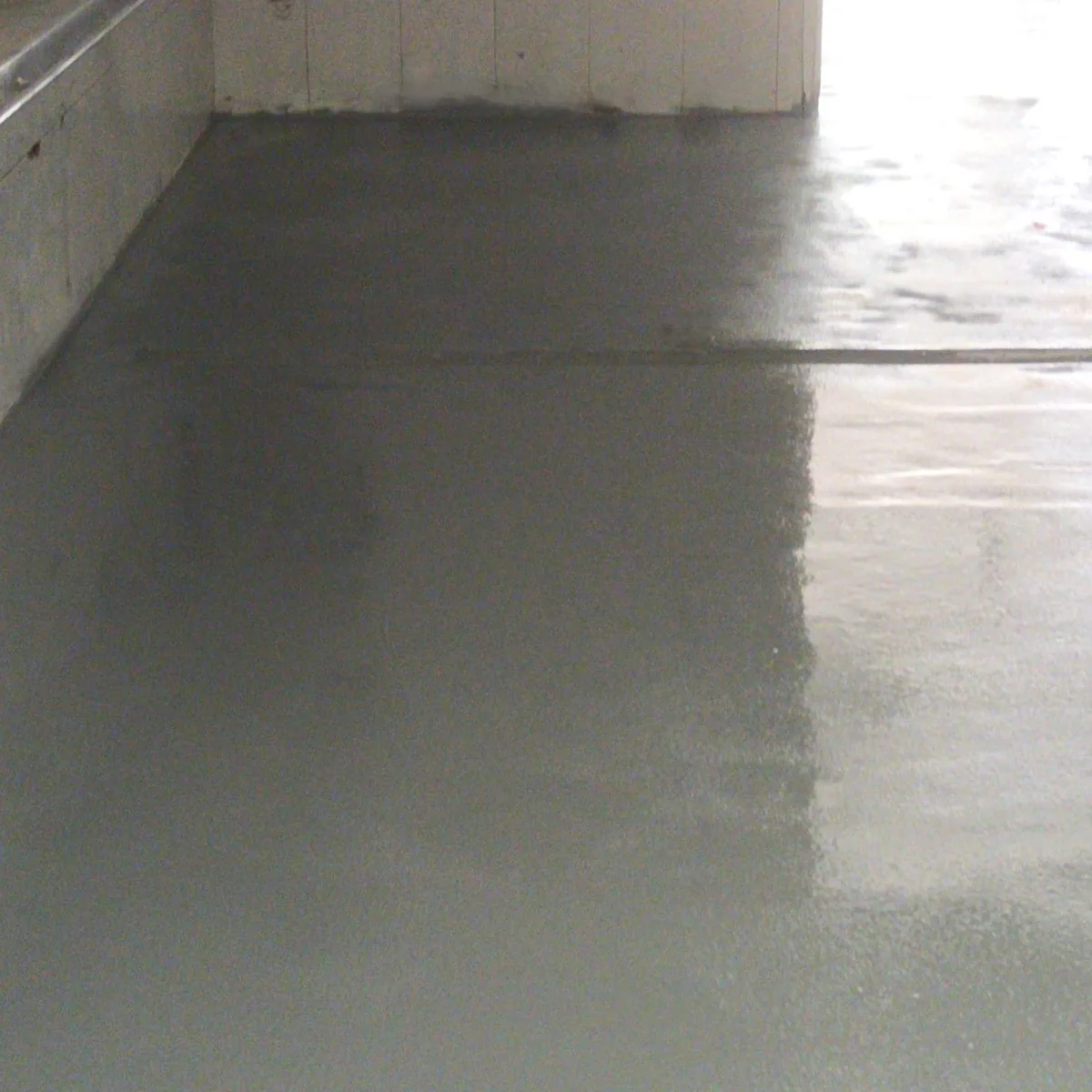 Coated floor running towards a bright doorway, Ciutadella