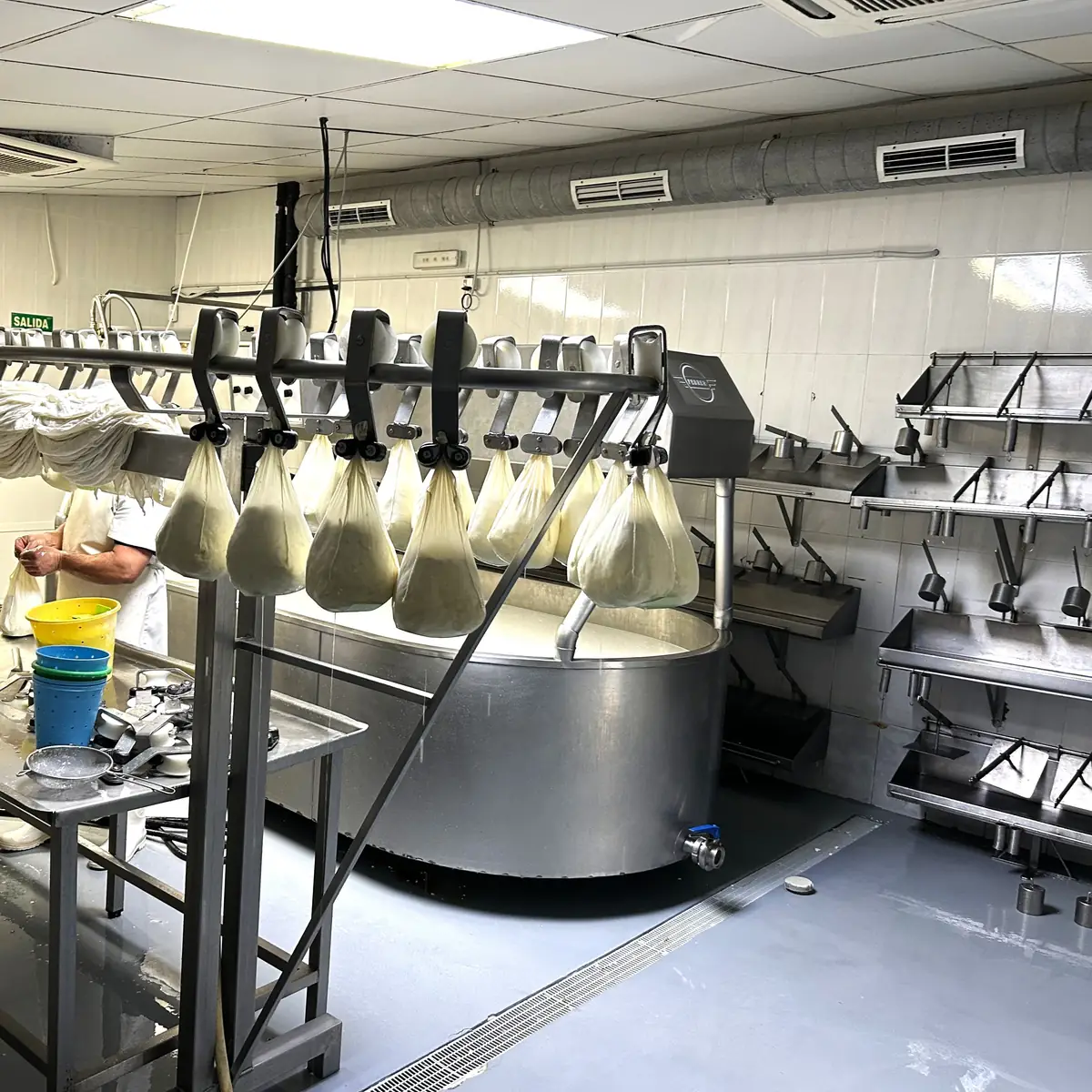 Cheese vats over the renewed grey floor, Ciutadella