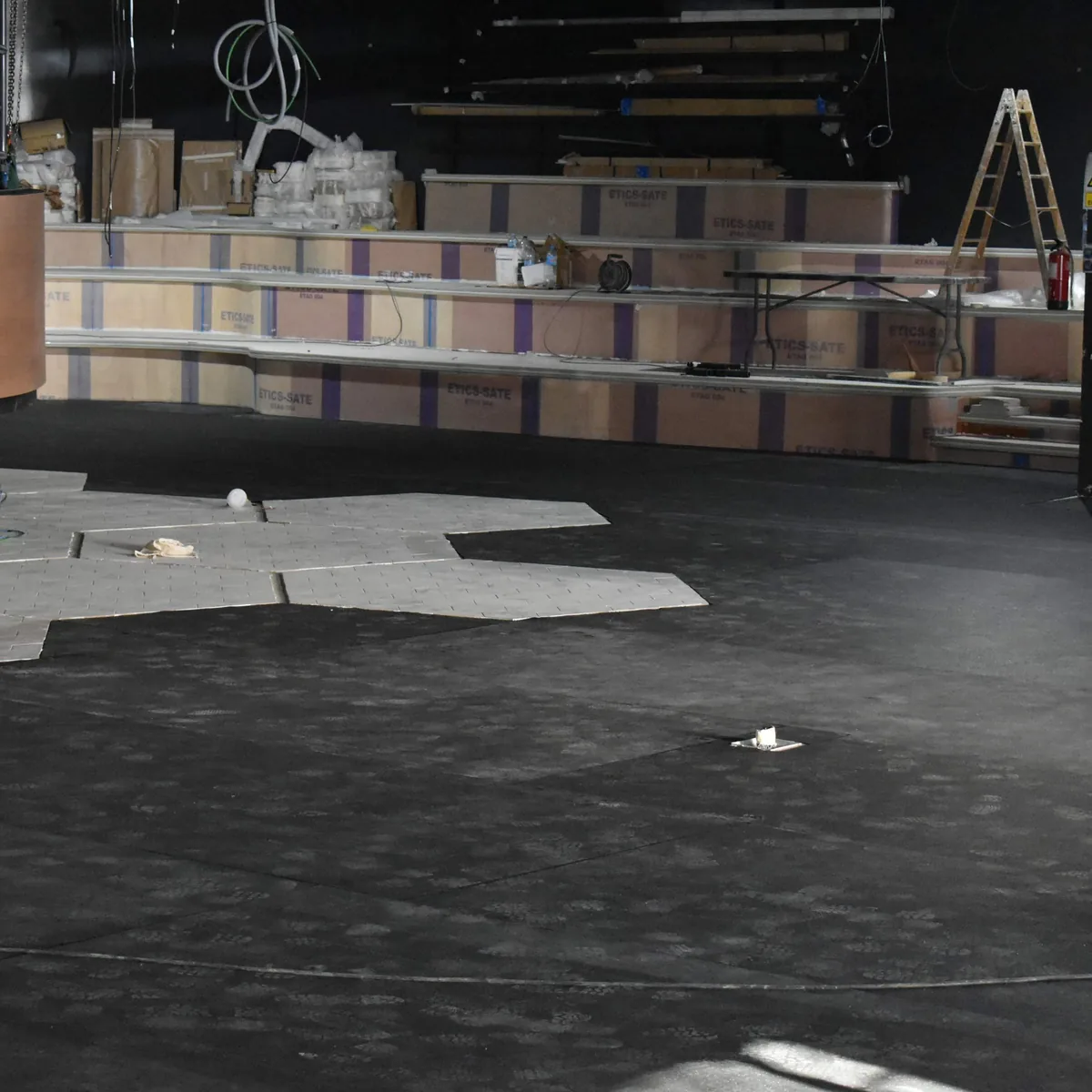Venue hall with dark substrate and hexagon panels before flooring, Salou
