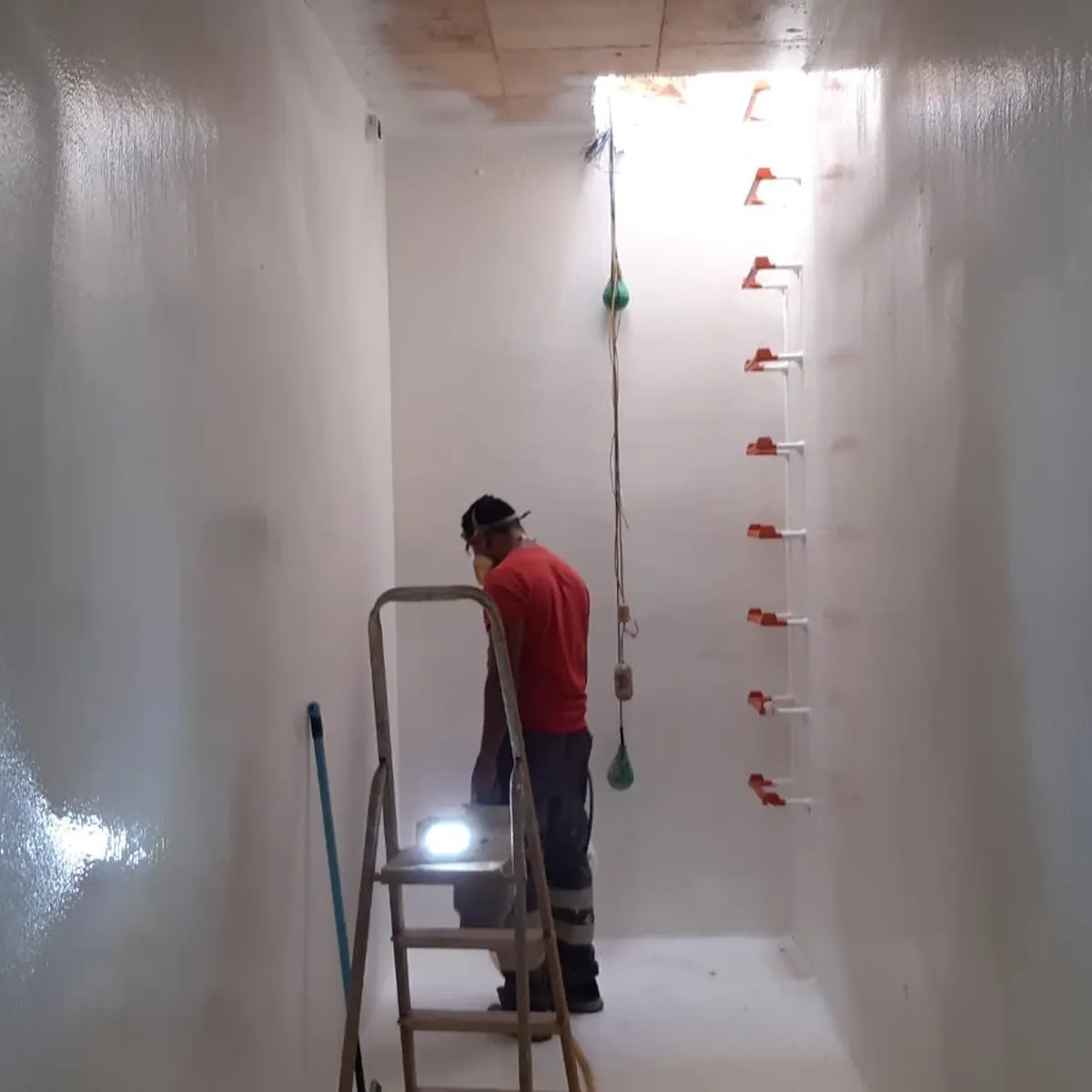 Close spray or roll of white lining on concrete, Tortosa