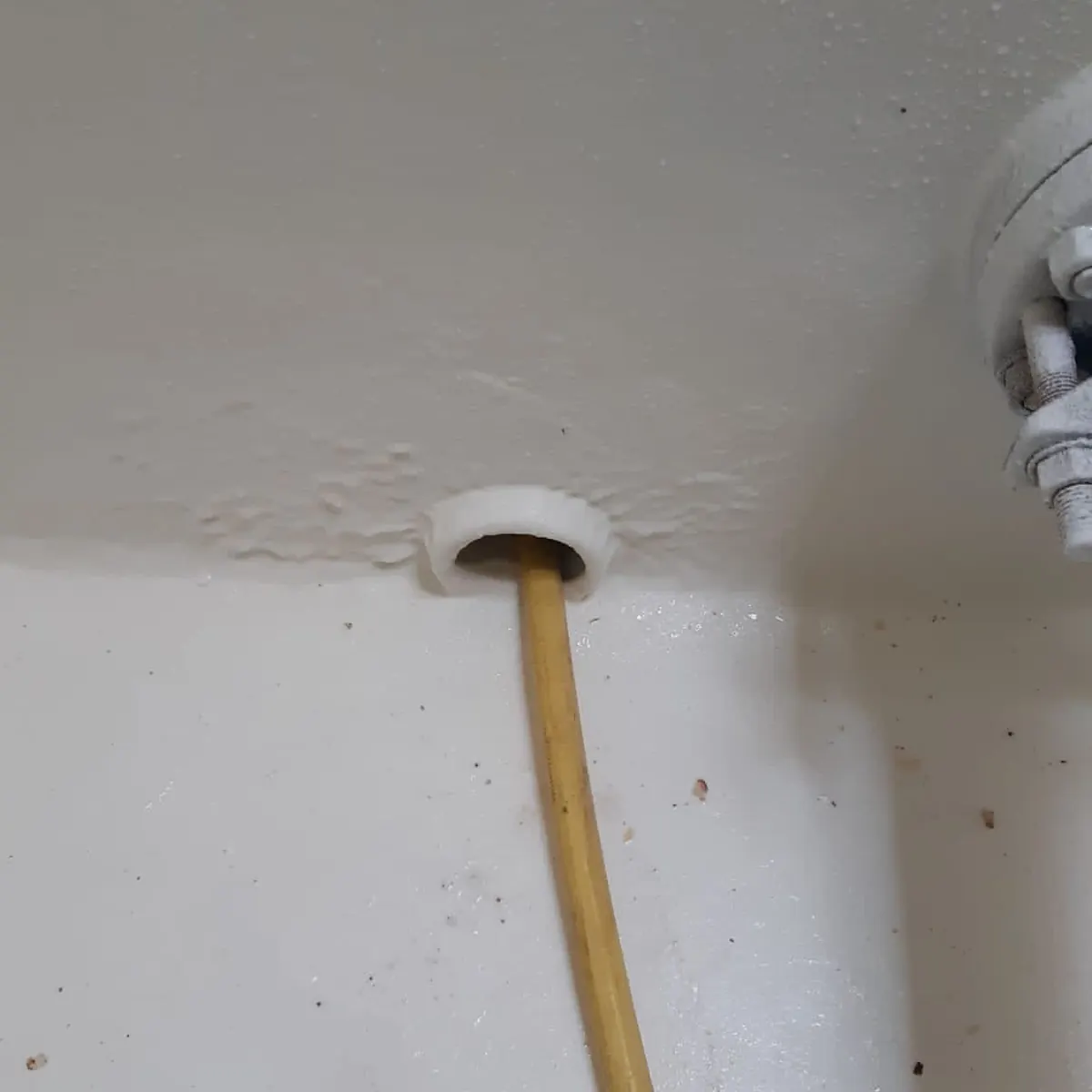 Sealed pipe penetration through white tank lining, Tortosa