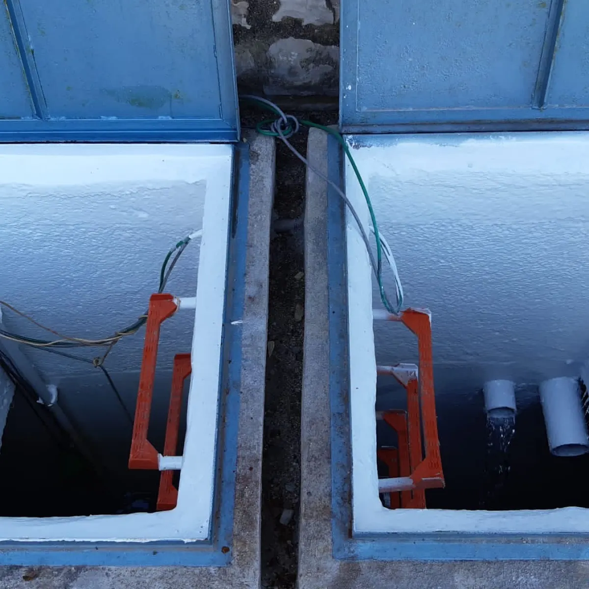 Exterior hatches over white tank interiors, Tortosa