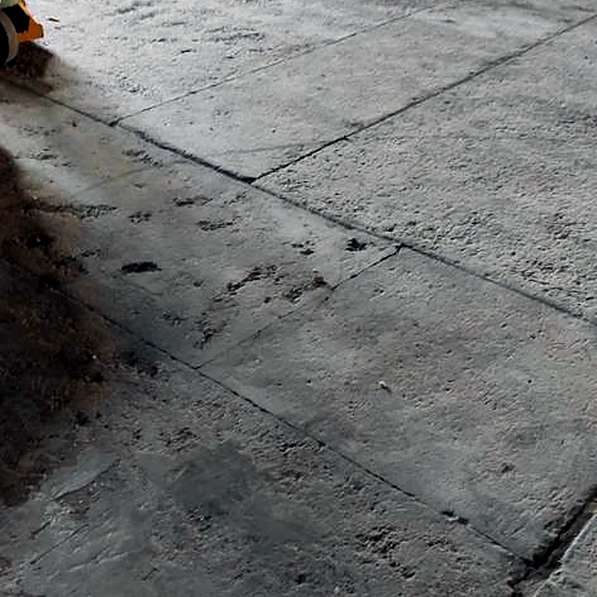 Stained slab running toward the warehouse wall