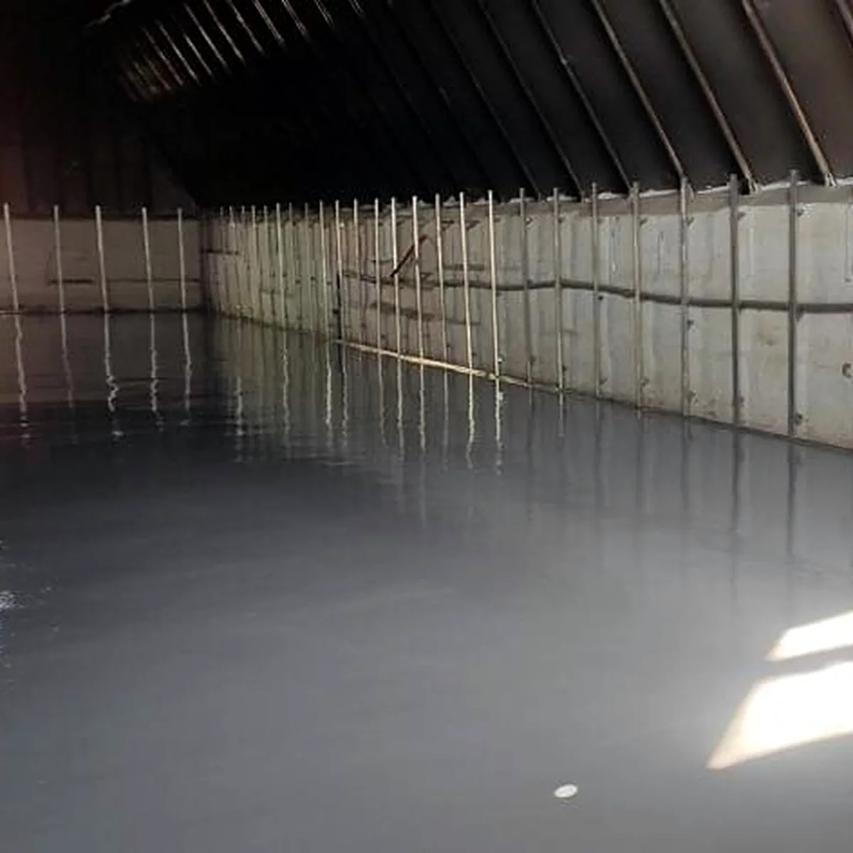 Grey epoxy floor along the side wall, drinks warehouse in Ukraine