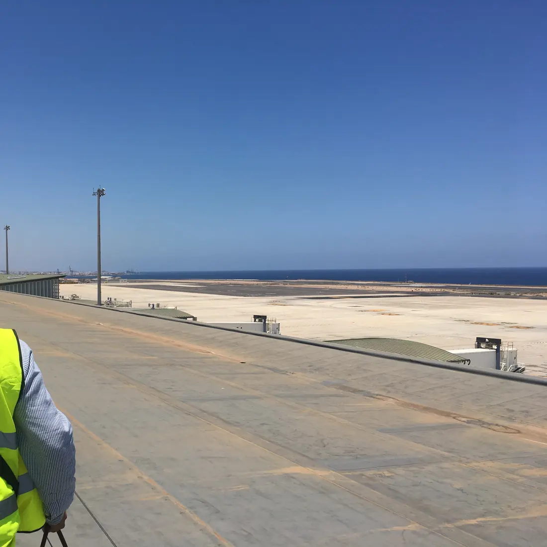 The runway and the sea seen from the airport roof