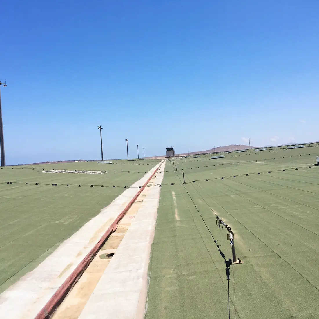 The old green roof running toward the control tower