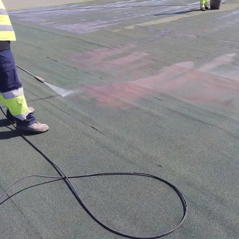 Close view of the pressure wash on the green airport roof membrane