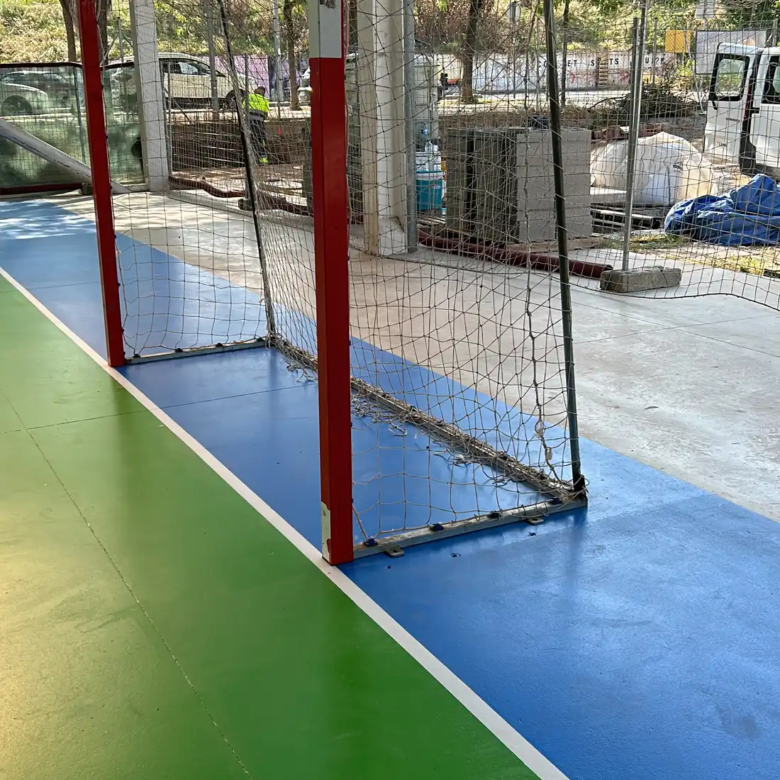 The green playing area meeting a white line The green playing area meeting a white line