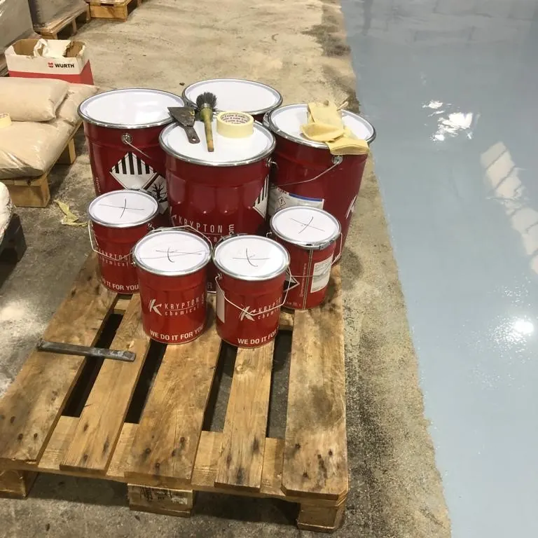 Resin drums on a pallet at the edge of the floor Resin drums on a pallet at the edge of the floor