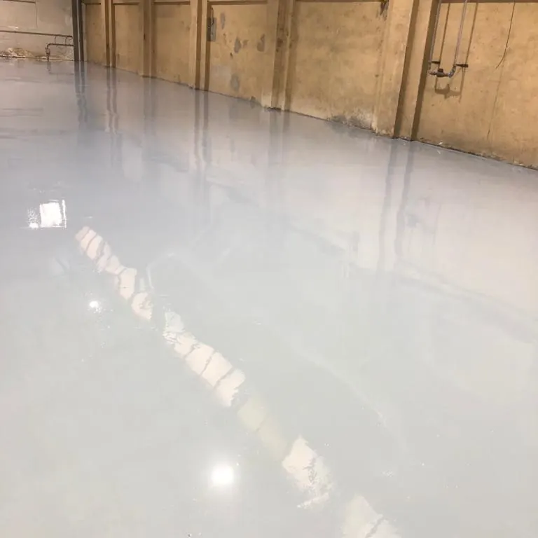 The glossy grey floor against a brick wall The glossy grey floor against a brick wall