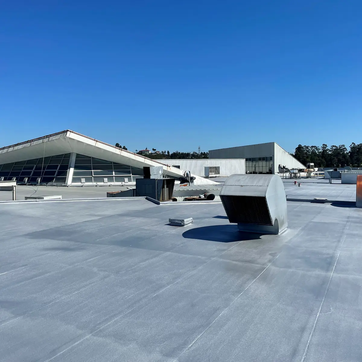 Finished grey roof with rooftop vents, Ferrara Plaza Finished grey roof with rooftop vents, Ferrara Plaza