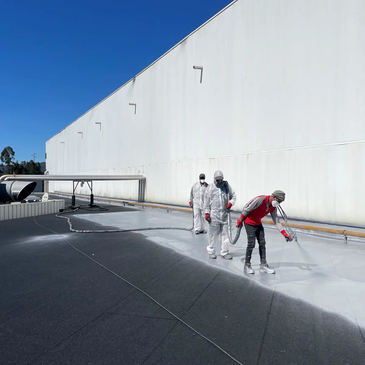Spray team on Ferrara Plaza roof waterproofing, Portugal Spray team on Ferrara Plaza roof waterproofing, Portugal