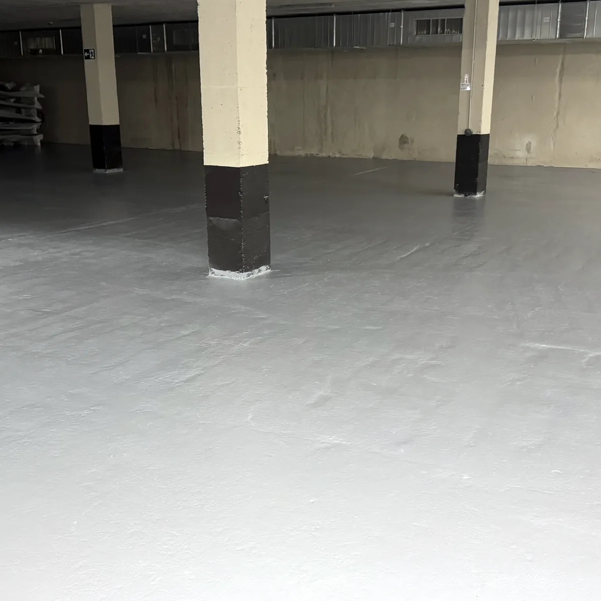 Open floor area with pillars at the back Open floor area with pillars at the back
