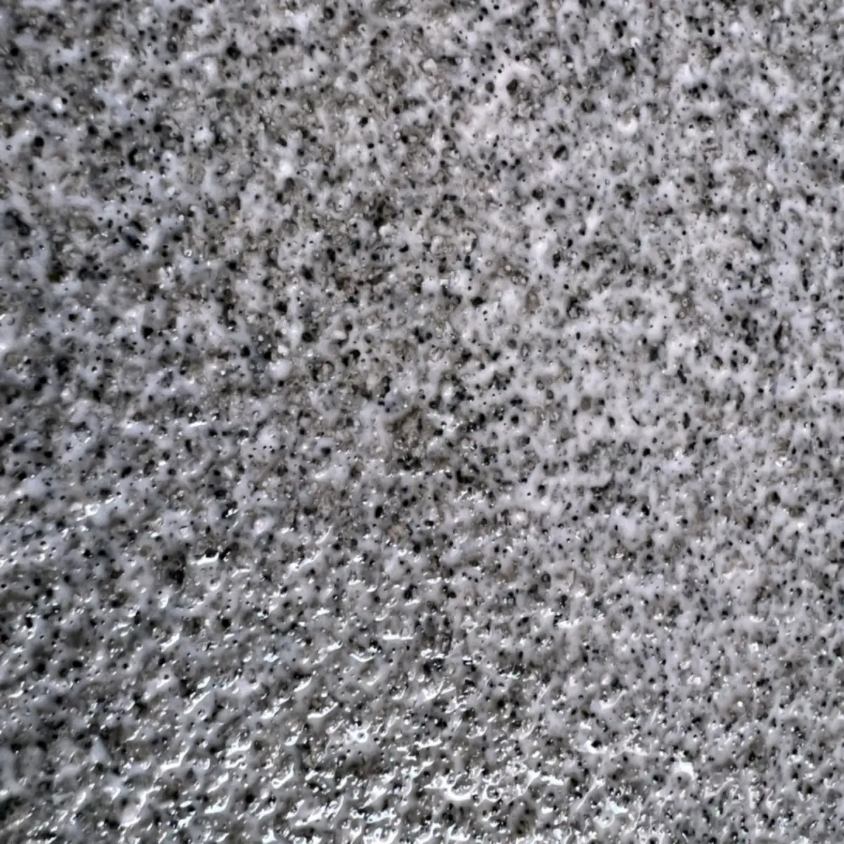 Detalle de la textura de árido gris y negro, Puerto Rico