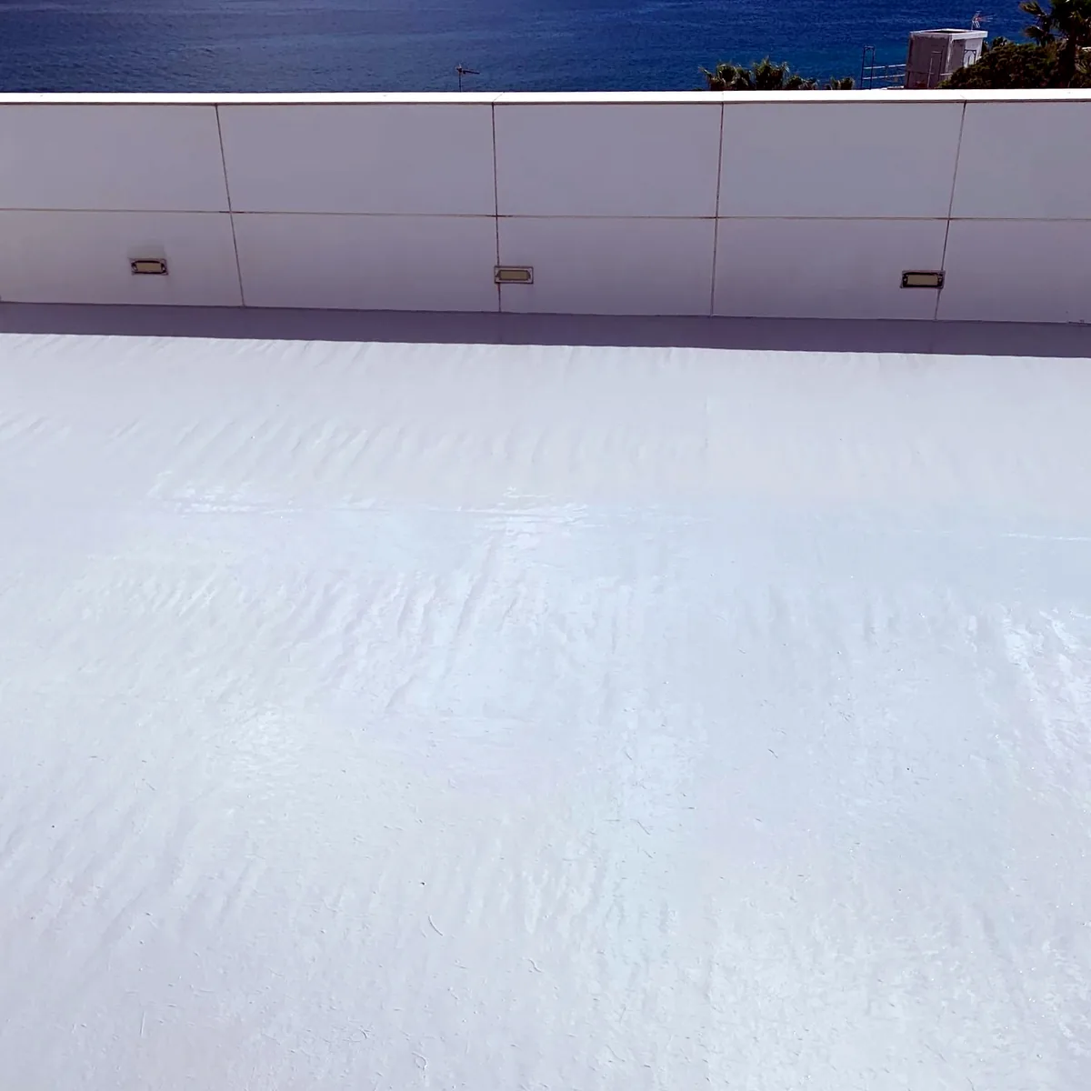 Even cool roof coat along the parapet with sea views, Tarragona