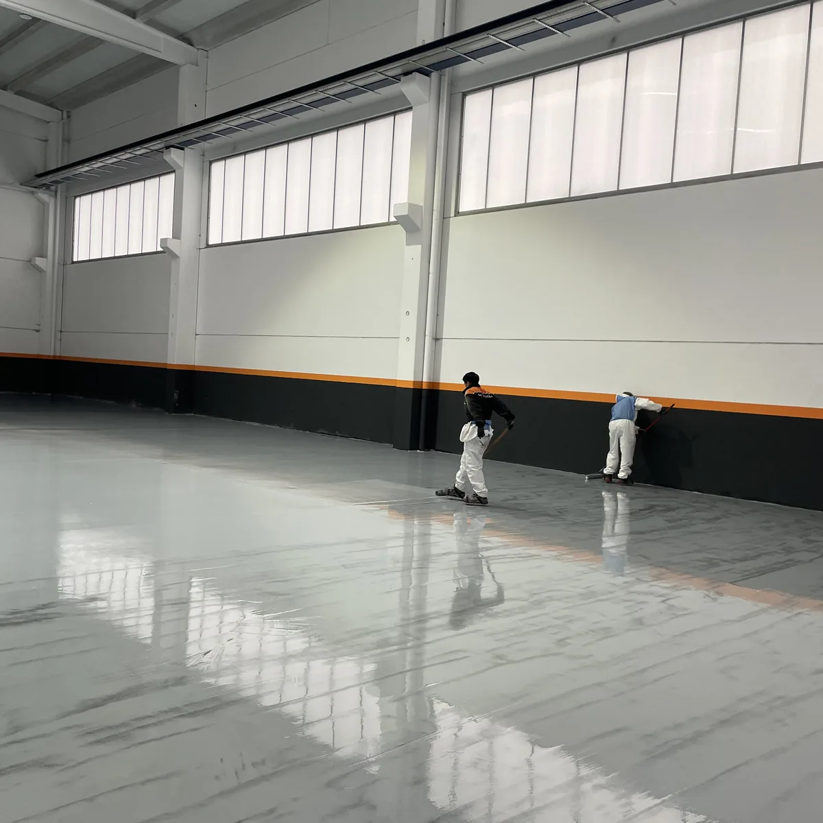Crew finishing the far end of the factory floor, Galicia Crew finishing the far end of the factory floor, Galicia
