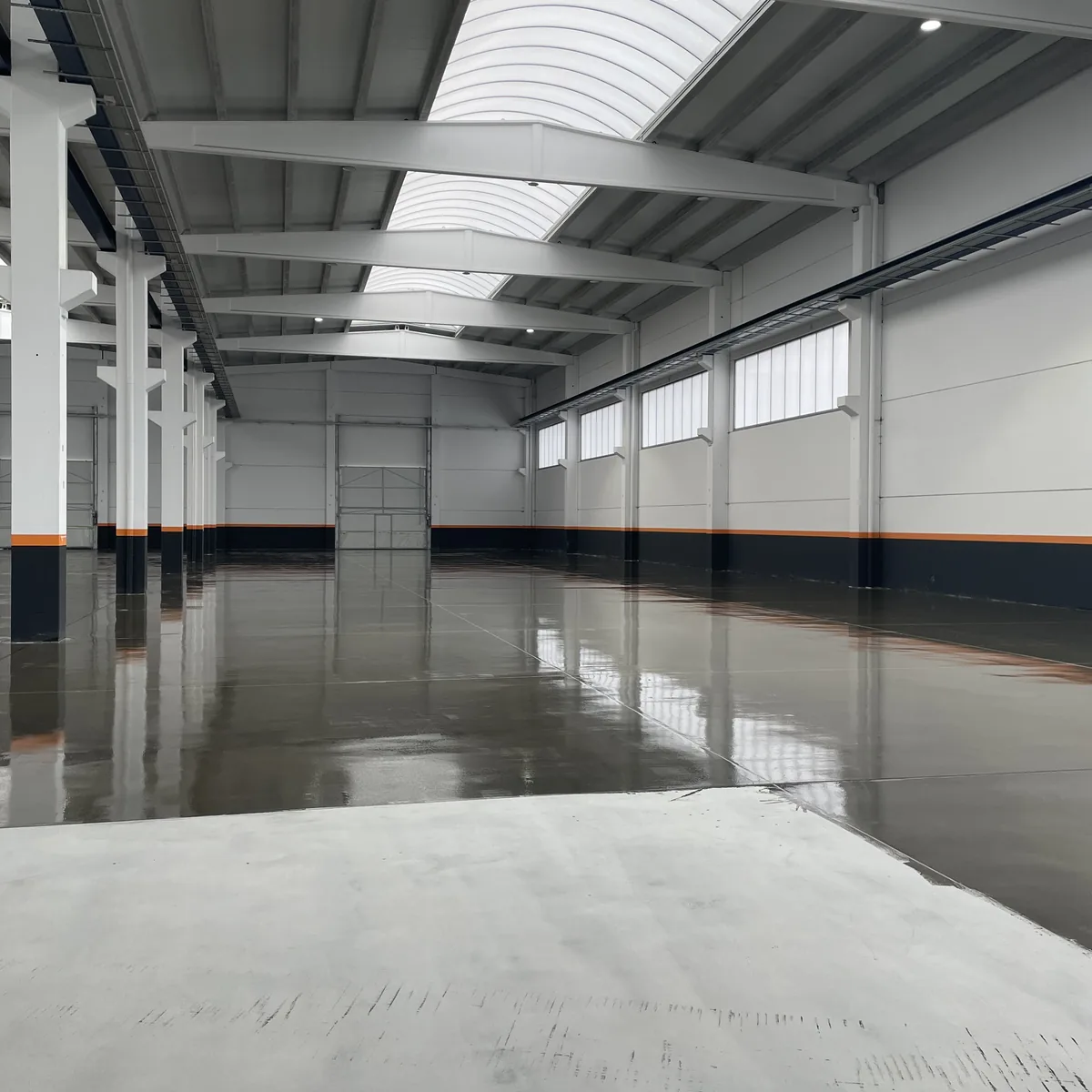 Freshly laid epoxy coat reflecting the roof lights, Galicia factory Freshly laid epoxy coat reflecting the roof lights, Galicia factory