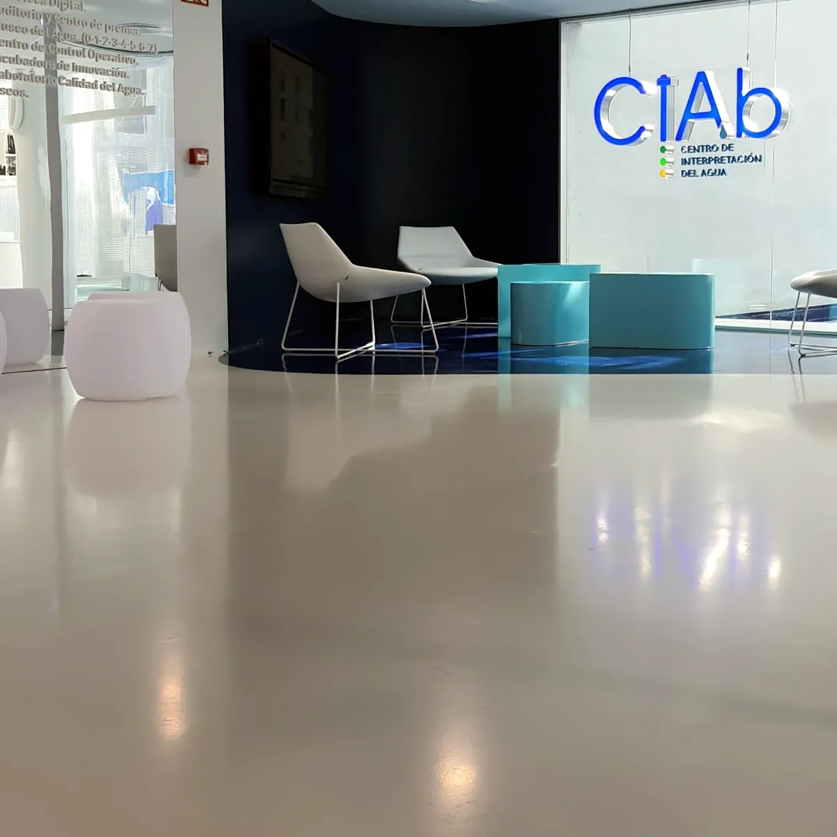 Glossy white floor running to a blue floor area and the CIAb sign, Albacete