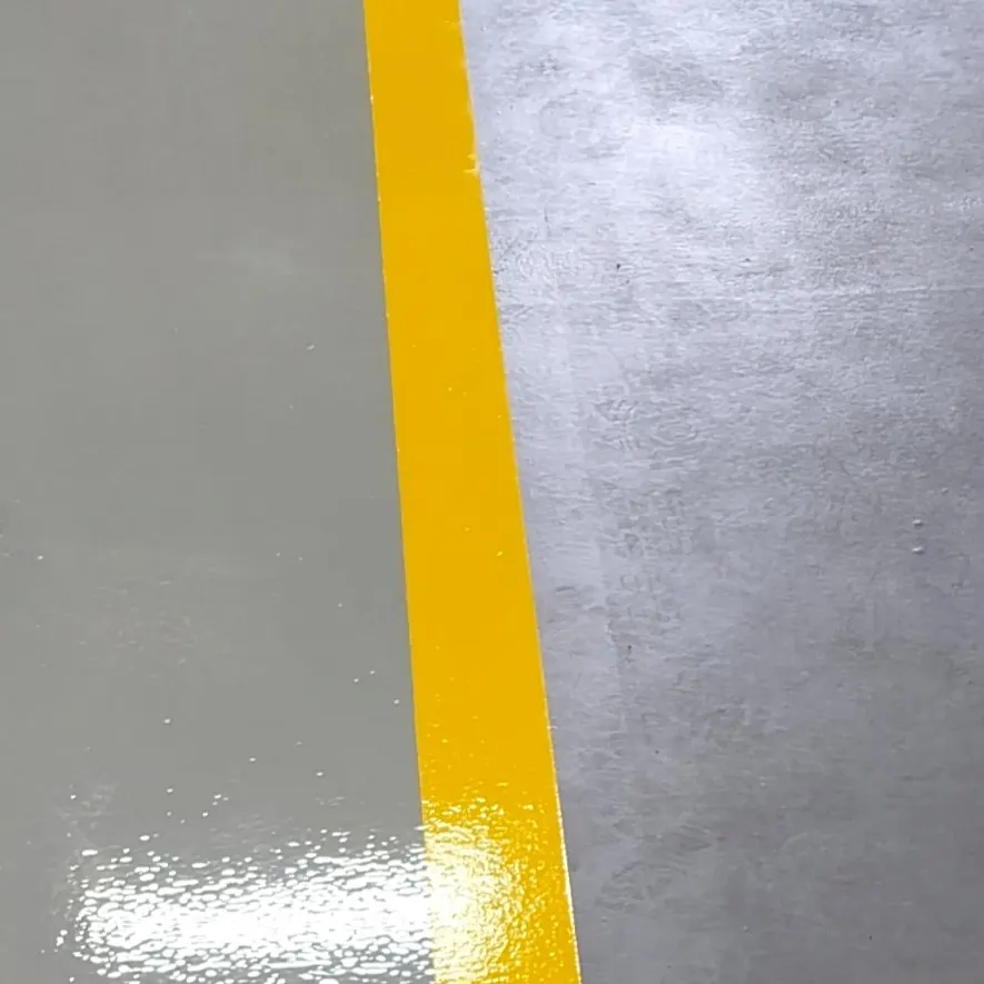A white walking figure between yellow lines A white walking figure between yellow lines