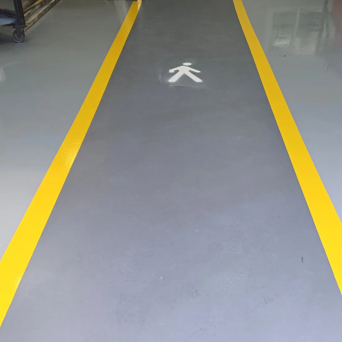 Yellow lines on the grey floor Yellow lines on the grey floor