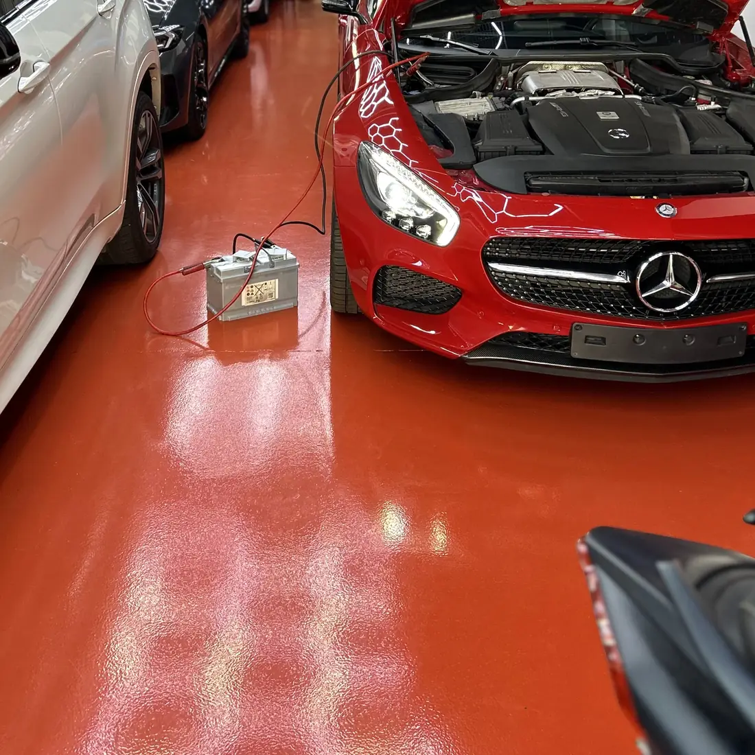 The red self-levelling floor under the cars
