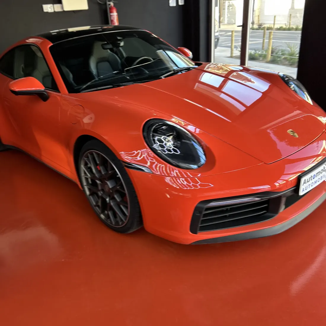 The red floor under a sports car