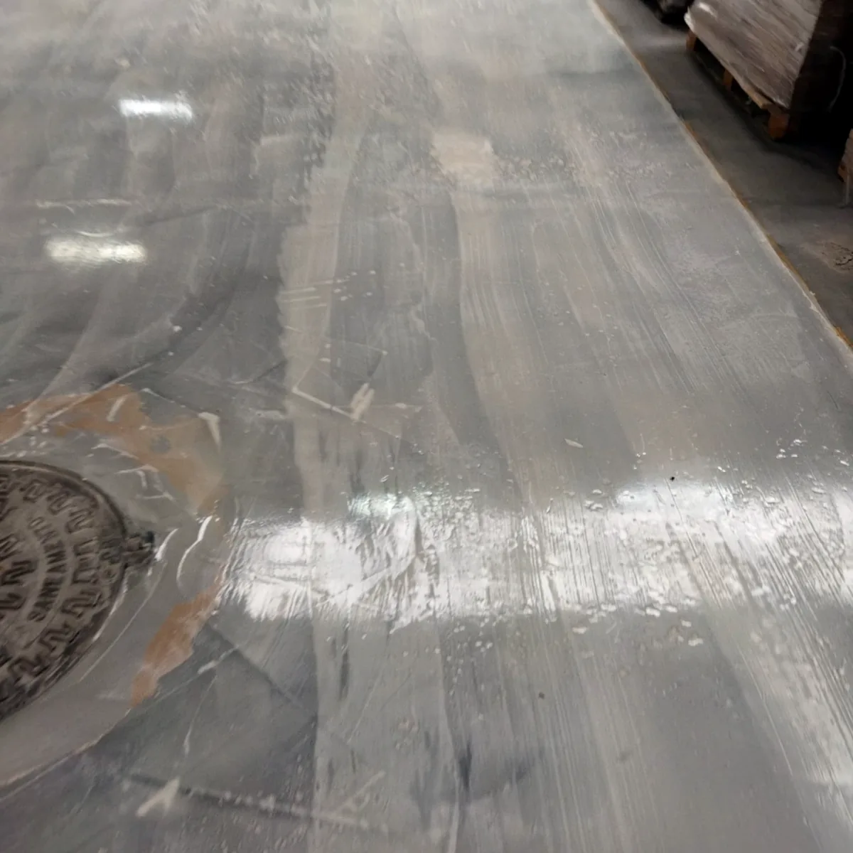 Coat worked up to the edge of a floor drain