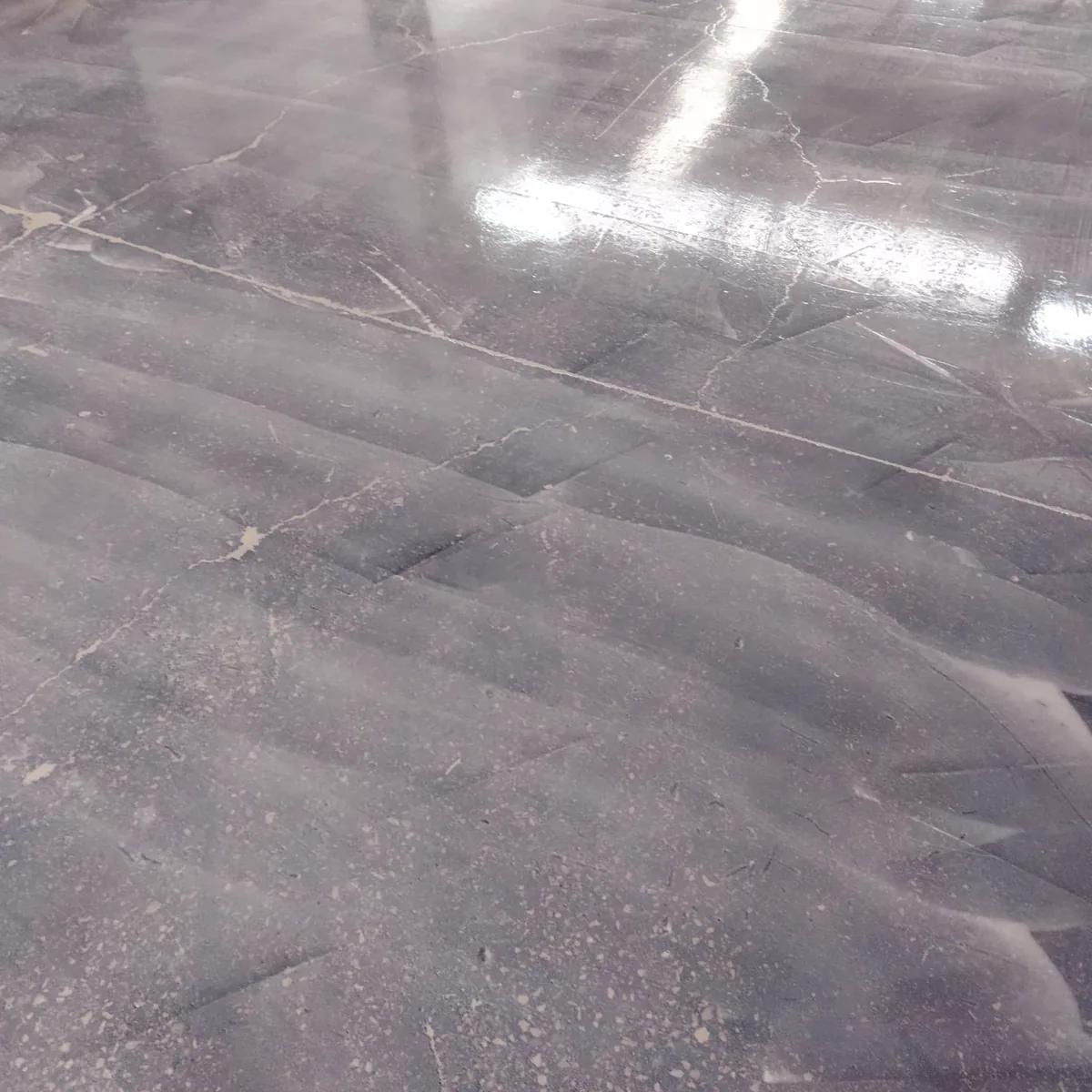 Glossy grey floor area with roof lights reflected, Porto