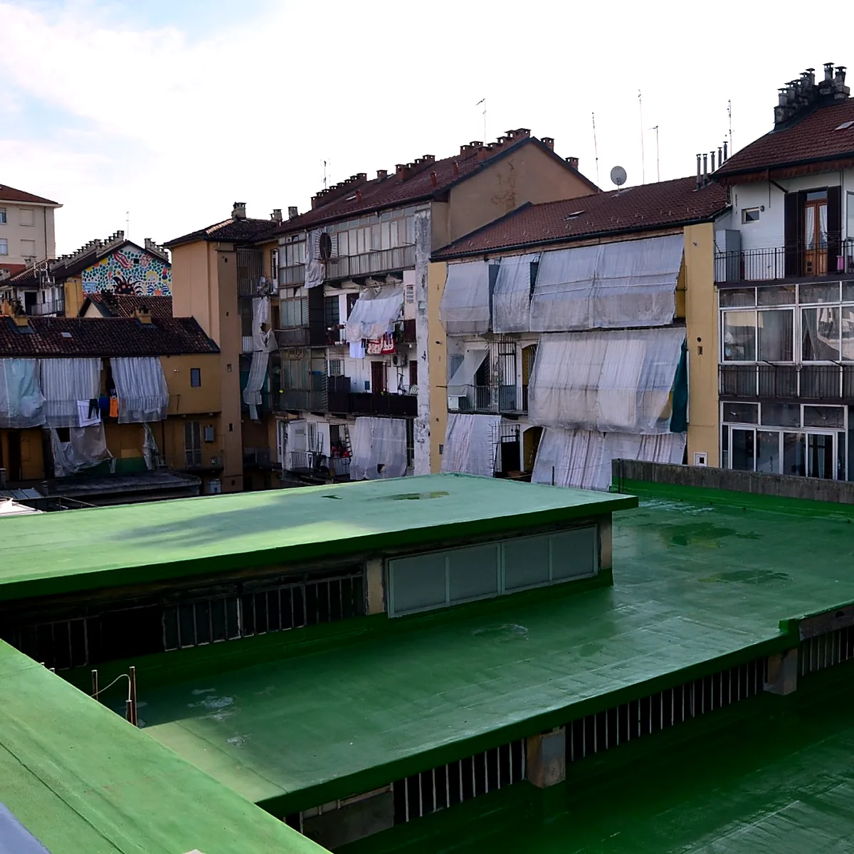 Coated roof sections between neighbouring buildings, mall roof in Turin Coated roof sections between neighbouring buildings, mall roof in Turin