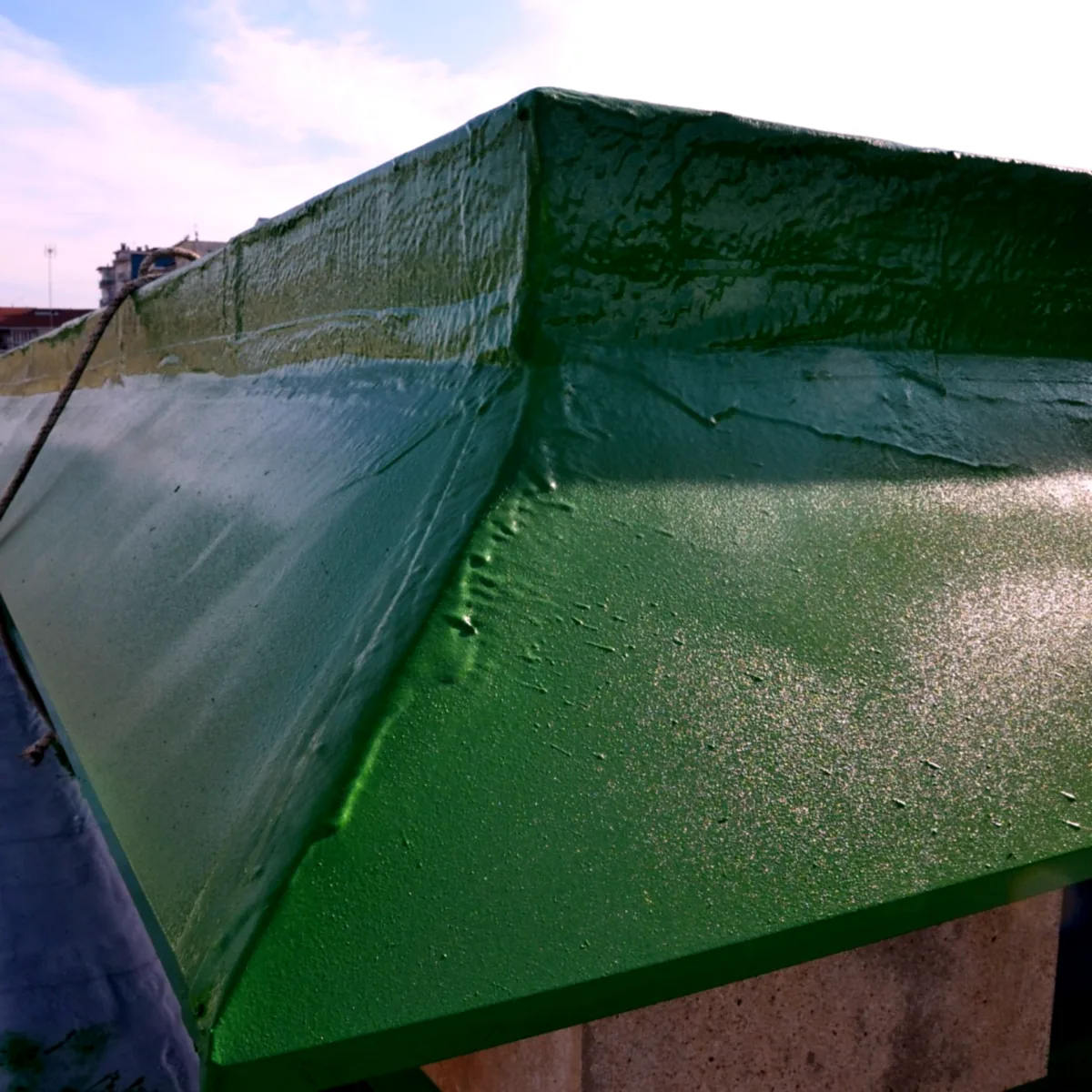 Mall roof waterproofing Turin: coated roof upstand and gutter edge, close view Mall roof waterproofing Turin: coated roof upstand and gutter edge, close view
