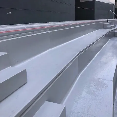 The light grey coat on the stepped aisle The light grey coat on the stepped aisle
