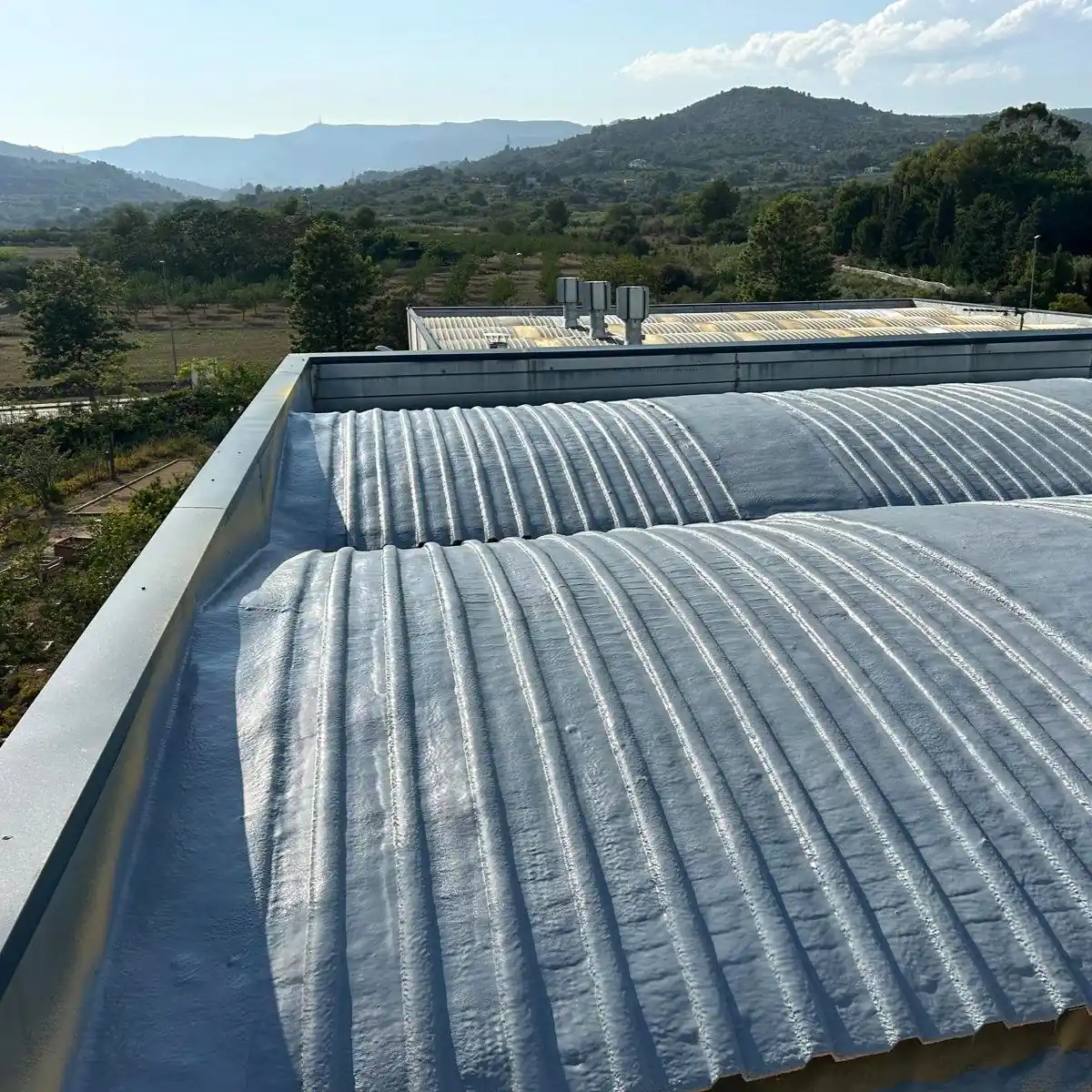 Finished grey membrane on the corrugated roof, Tarragona