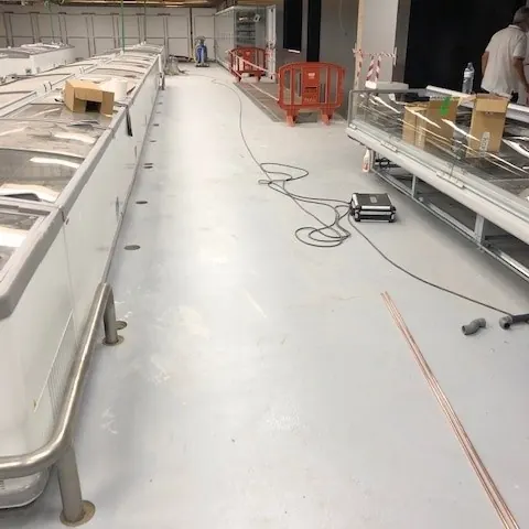 Pale floor running between chest freezers