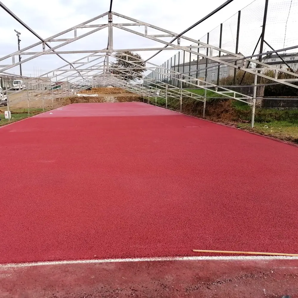 Ordes athletics track flooring: the red straight under the roof frame