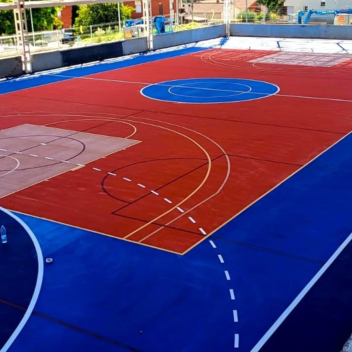 Finished red and blue multisport court, Cervelló Finished red and blue multisport court, Cervelló