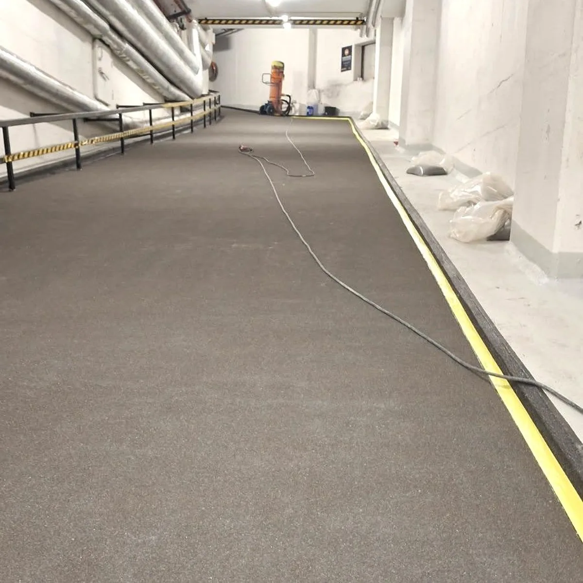 Grey coated garage ramp with yellow edge line, Norway Grey coated garage ramp with yellow edge line, Norway