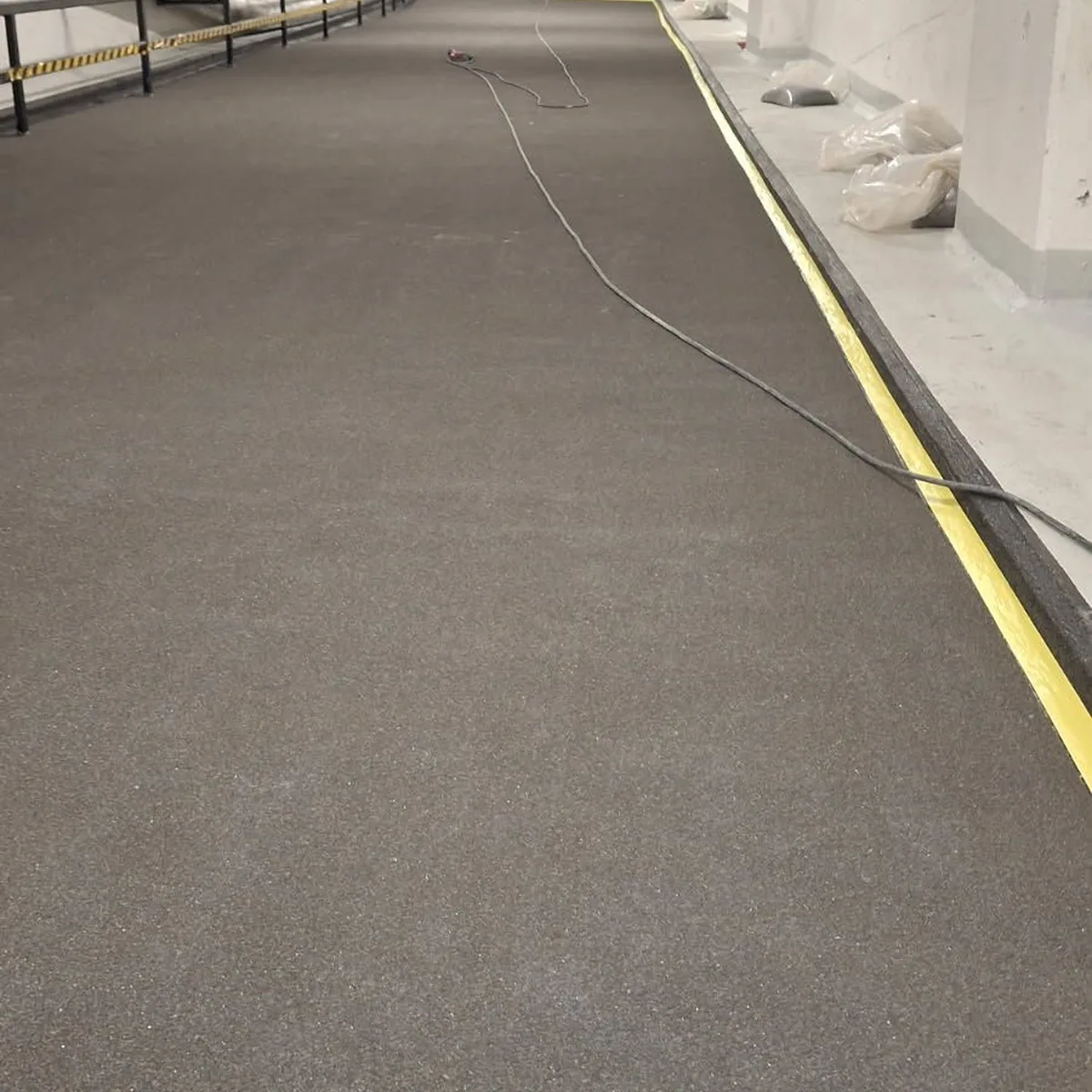 Long grey garage aisle after coating, Norway Long grey garage aisle after coating, Norway