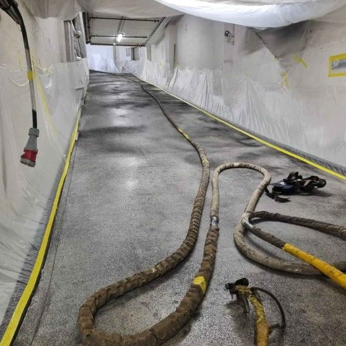 Spray hoses on the garage ramp during polyurea application, Norway Spray hoses on the garage ramp during polyurea application, Norway