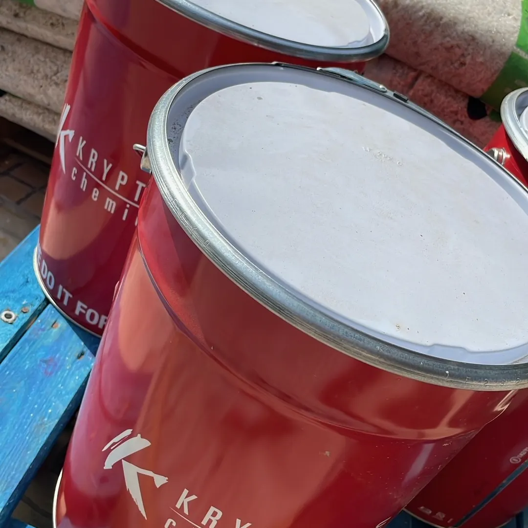 Resin drums on a pallet beside the garden Resin drums on a pallet beside the garden