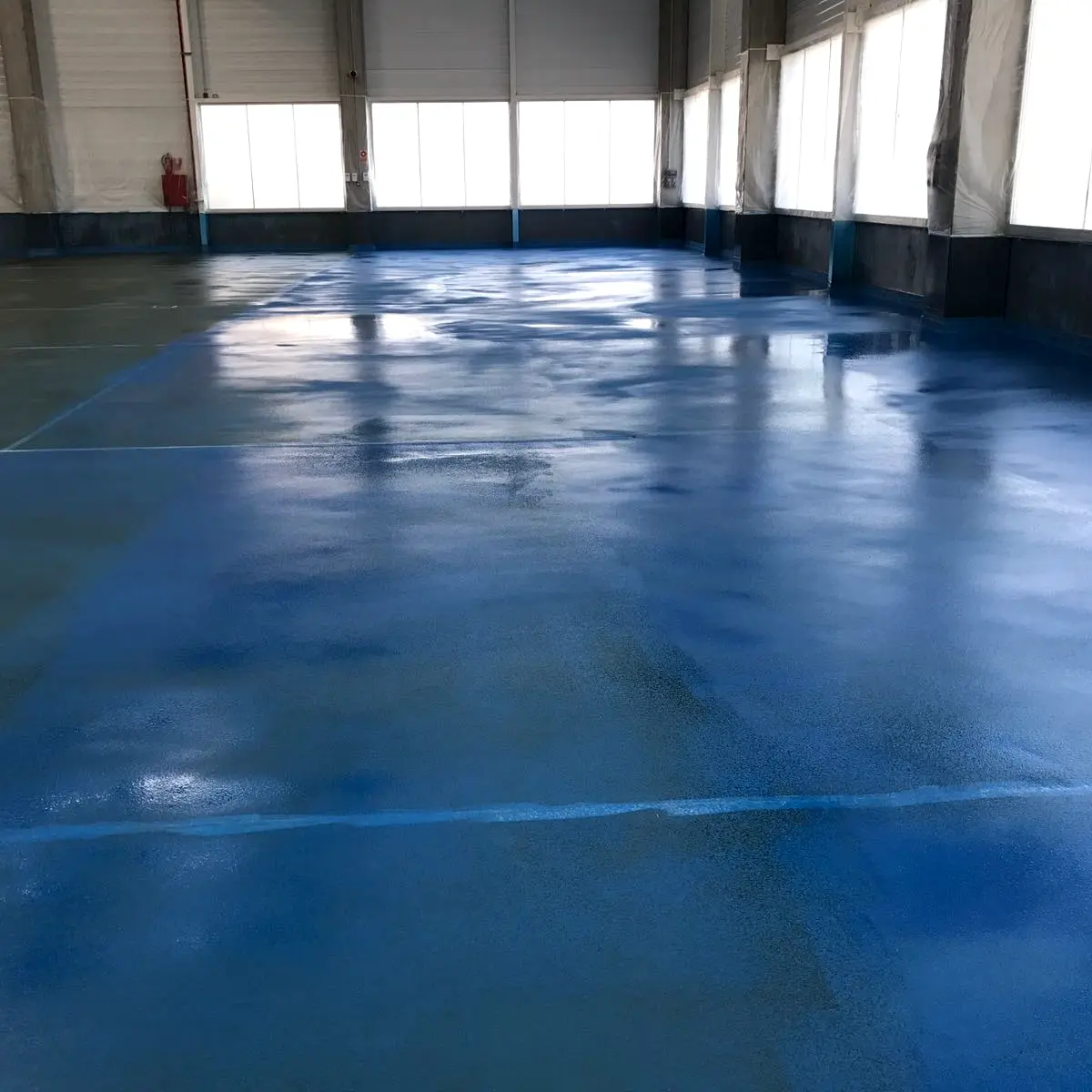 Blue polyurethane floor across the production hall, Algeria pharma plant