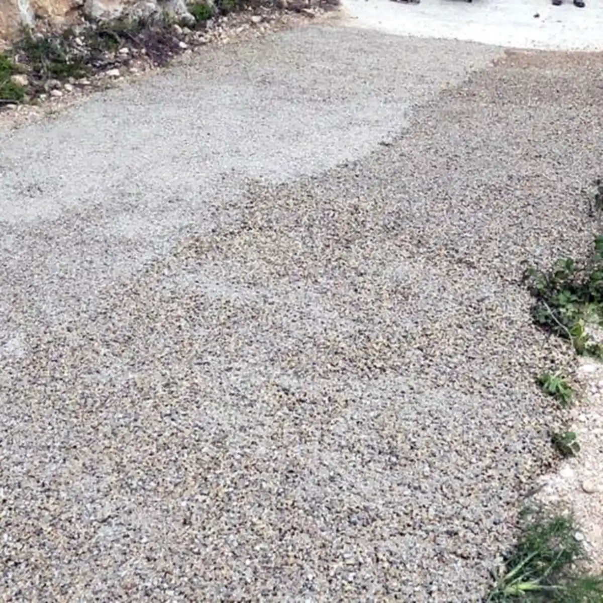 Finished resin-bound stone path between grass verges, Vandellòs Finished resin-bound stone path between grass verges, Vandellòs