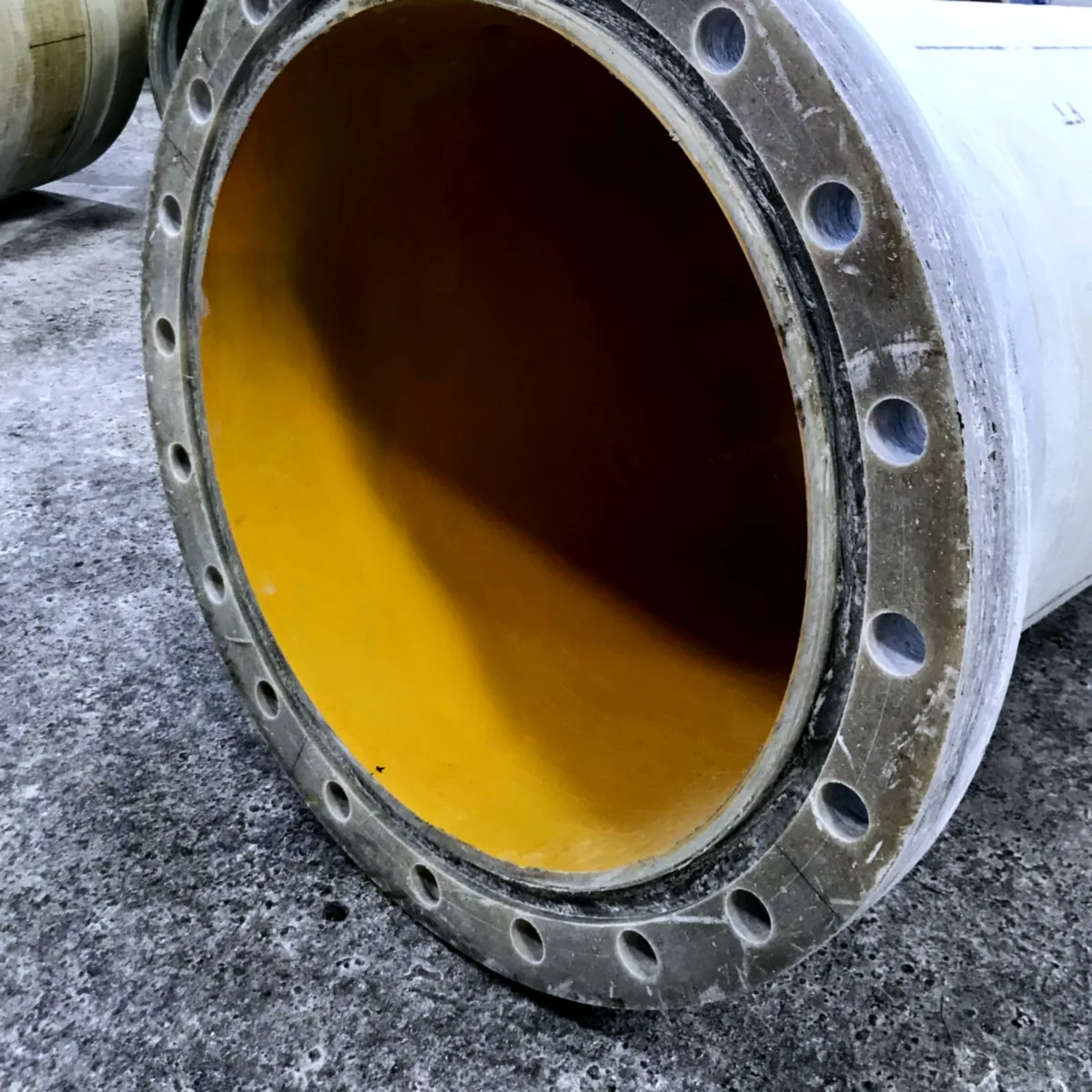 Flanged pipe section with a yellow ProLine CH55 interior lining Flanged pipe section with a yellow ProLine CH55 interior lining