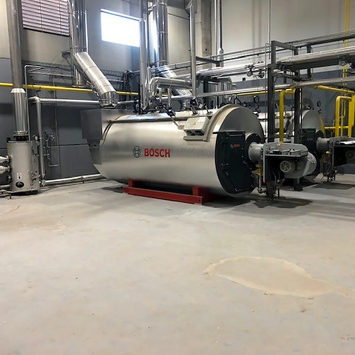 Boiler room floor finished with Impermax 2K M around a large boiler, Sallent Boiler room floor finished with Impermax 2K M around a large boiler, Sallent
