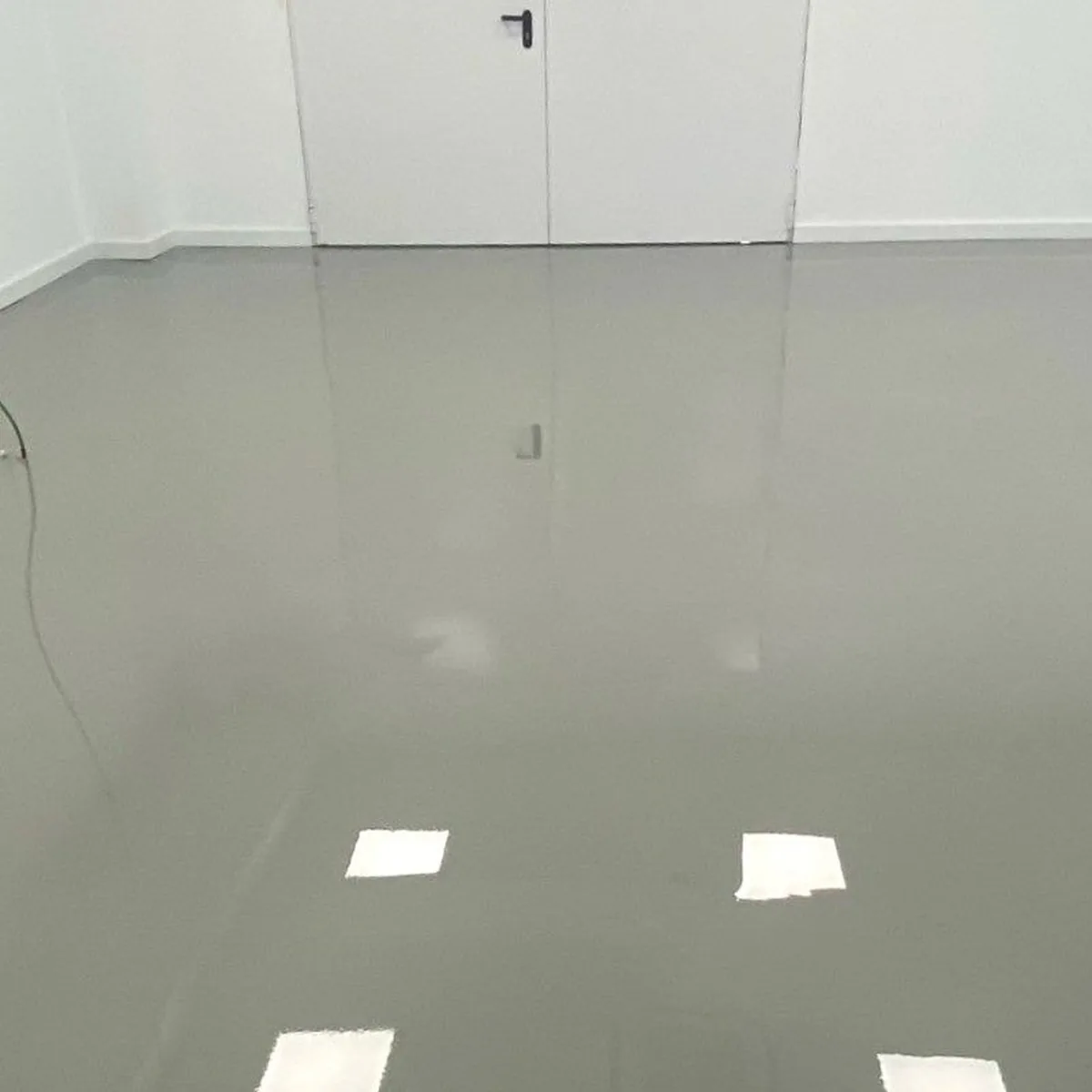 Empty room with the finished grey floor and doors, Logroño Empty room with the finished grey floor and doors, Logroño